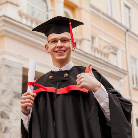 graduated-boy-showing-ok-sign