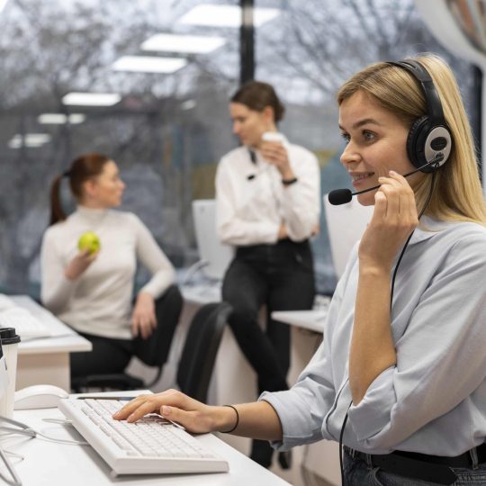 woman-working-call-center-talking-with-clients-using-headphones-microphone-min